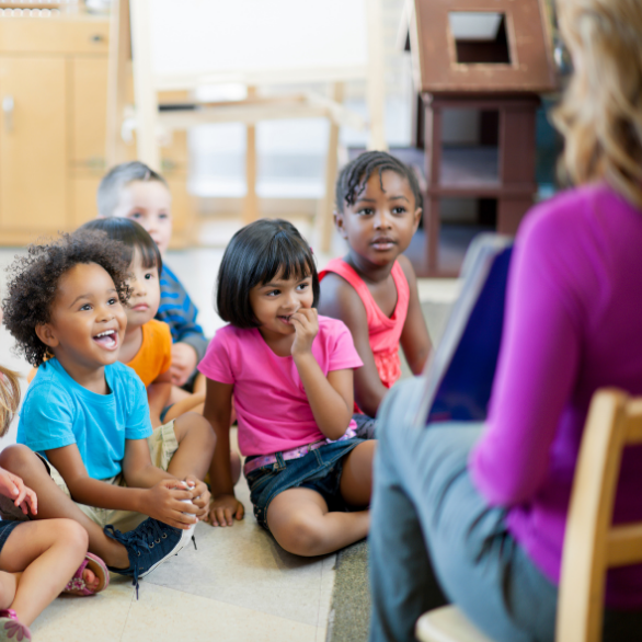 Teacher engaging with students during circle time.